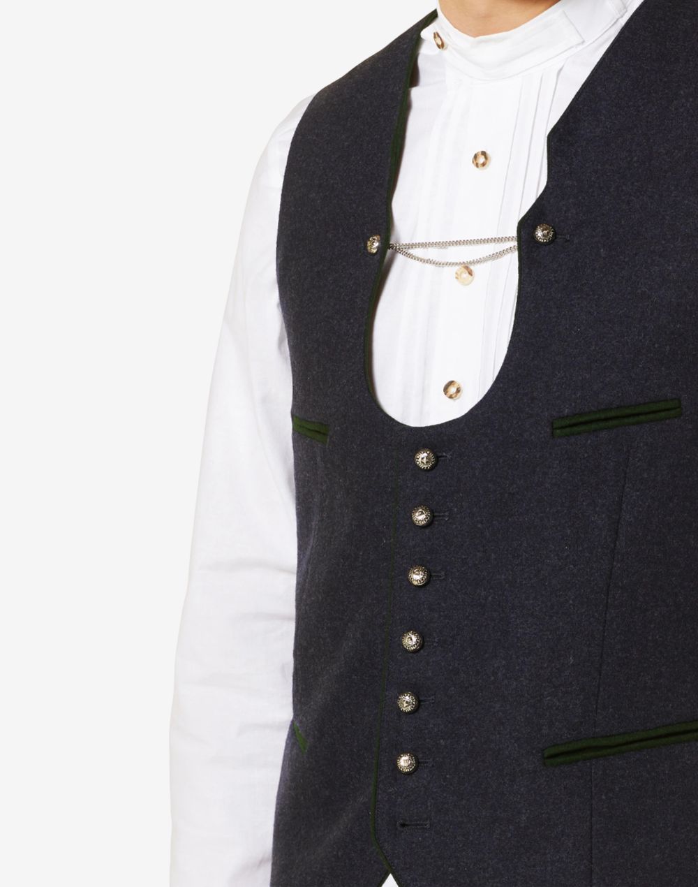 Close up of mens blue wool Bavarian vest showing decorative metal buttons, green piping and traditional Alpine tailoring.