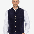 Model wearing mens classic Bavarian waistcoat paired with shirt and lederhosen for authentic Oktoberfest outfit.