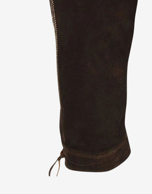 Close up view of leather bundhosen leg showing smooth leather texture, side stitching and traditional knee tie detail