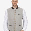 Model wearing mens classic Trachten waistcoat with grey wool fabric, brown collar and traditional Oktoberfest outfit styling.