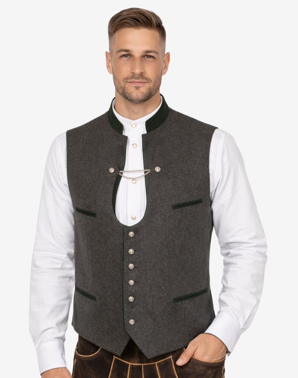 Model wearing mens elegant Trachten vest paired with traditional shirt and lederhosen for authentic Bavarian Oktoberfest outfit.