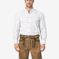 Model wearing forest stag lederhosen for men in light brown leather with traditional Bavarian embroidery