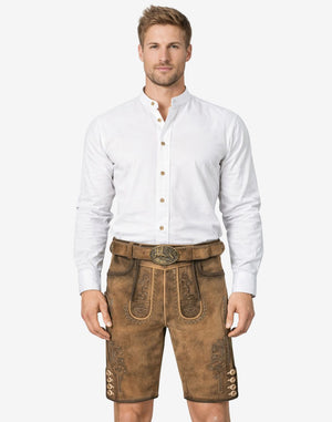 Model wearing forest stag lederhosen for men in light brown leather with traditional Bavarian embroidery