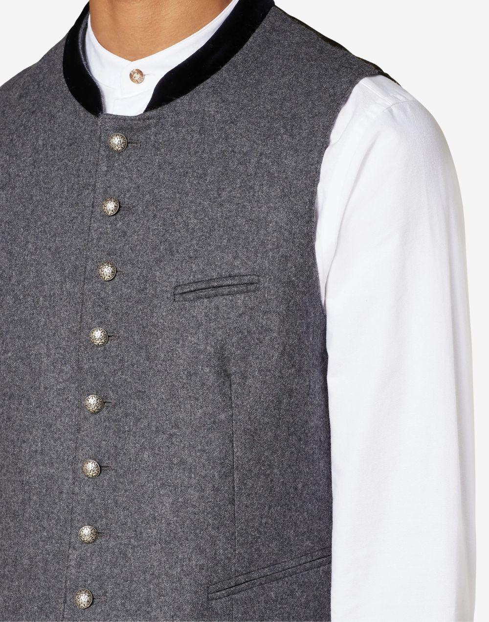 Close up of mens gray wool Trachten vest showing traditional horn buttons, textured wool fabric and Bavarian craftsmanship.