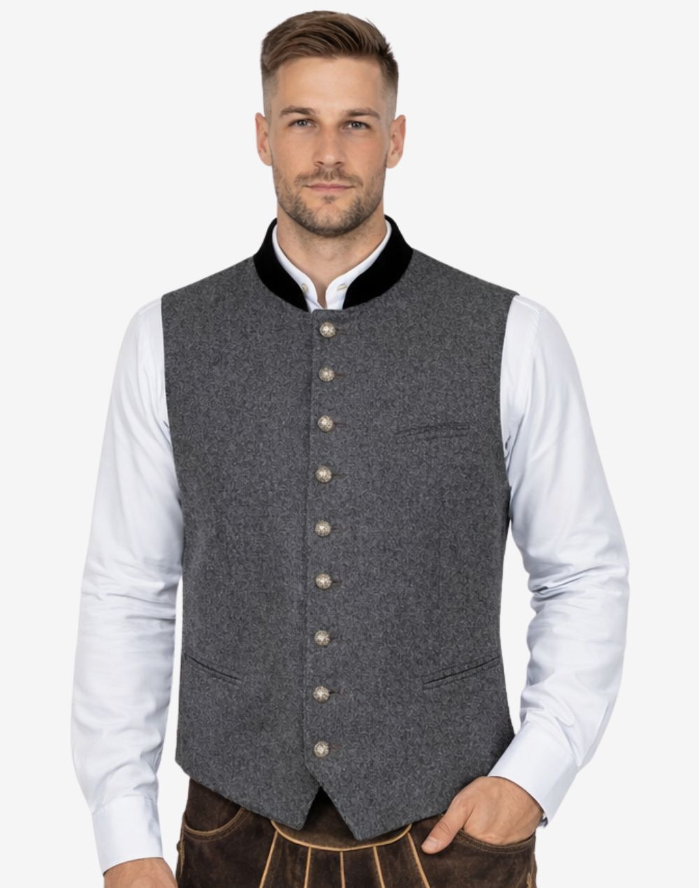 Model wearing mens gray wool Trachten vest paired with traditional shirt and lederhosen for classic Bavarian Oktoberfest outfit.