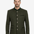 Model wearing stylish green wool Trachten jacket front view featuring traditional buttons and classic Oktoberfest outfit style.