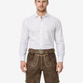 Model wearing mens heritage style lederhosen in brown leather with traditional Bavarian embroidery and decorative belt