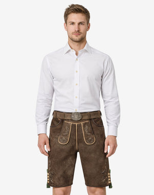 Model wearing mens heritage style lederhosen in brown leather with traditional Bavarian embroidery and decorative belt