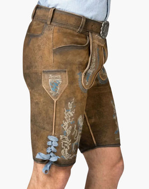 Brown leather shorts with embroidery on a white background