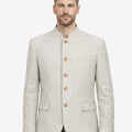 Model wearing premium off white wool Trachten jacket front view highlighting traditional buttons and elegant alpine styling.