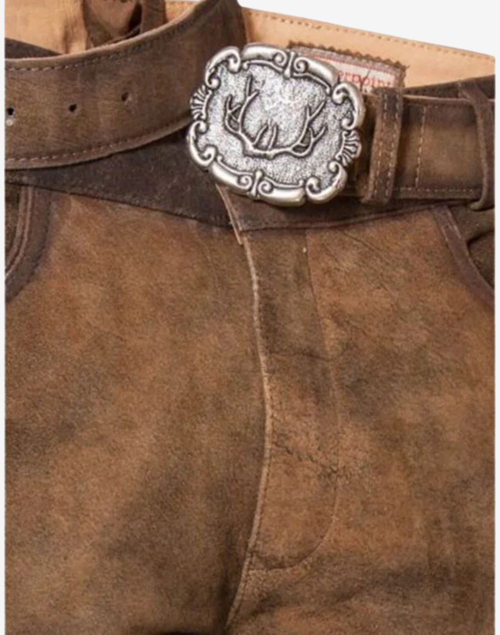 Close up of leather bundhosen belt showing decorative metal buckle, natural leather texture and traditional Bavarian craftsmanship