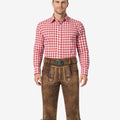 Front view of model wearing mens Oktoberfest leather Bundhosen in brown with Bavarian embroidery and traditional knee tie detailing