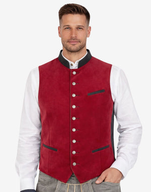 Front view of model wearing Mens Oktoberfest Trachten Vest in red suede with silver buttons and black trim detail