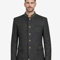 Model wearing Oktoberfest wool jacket front view highlighting alpine buttons, stand collar and authentic Bavarian festival style.