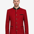 Back view of model wearing luxury red German jacket showing tailored structure and traditional Bavarian Trachten fit.