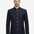 Model wearing rustic alpine Trachten jacket front view featuring classic buttons and authentic Bavarian Oktoberfest style.