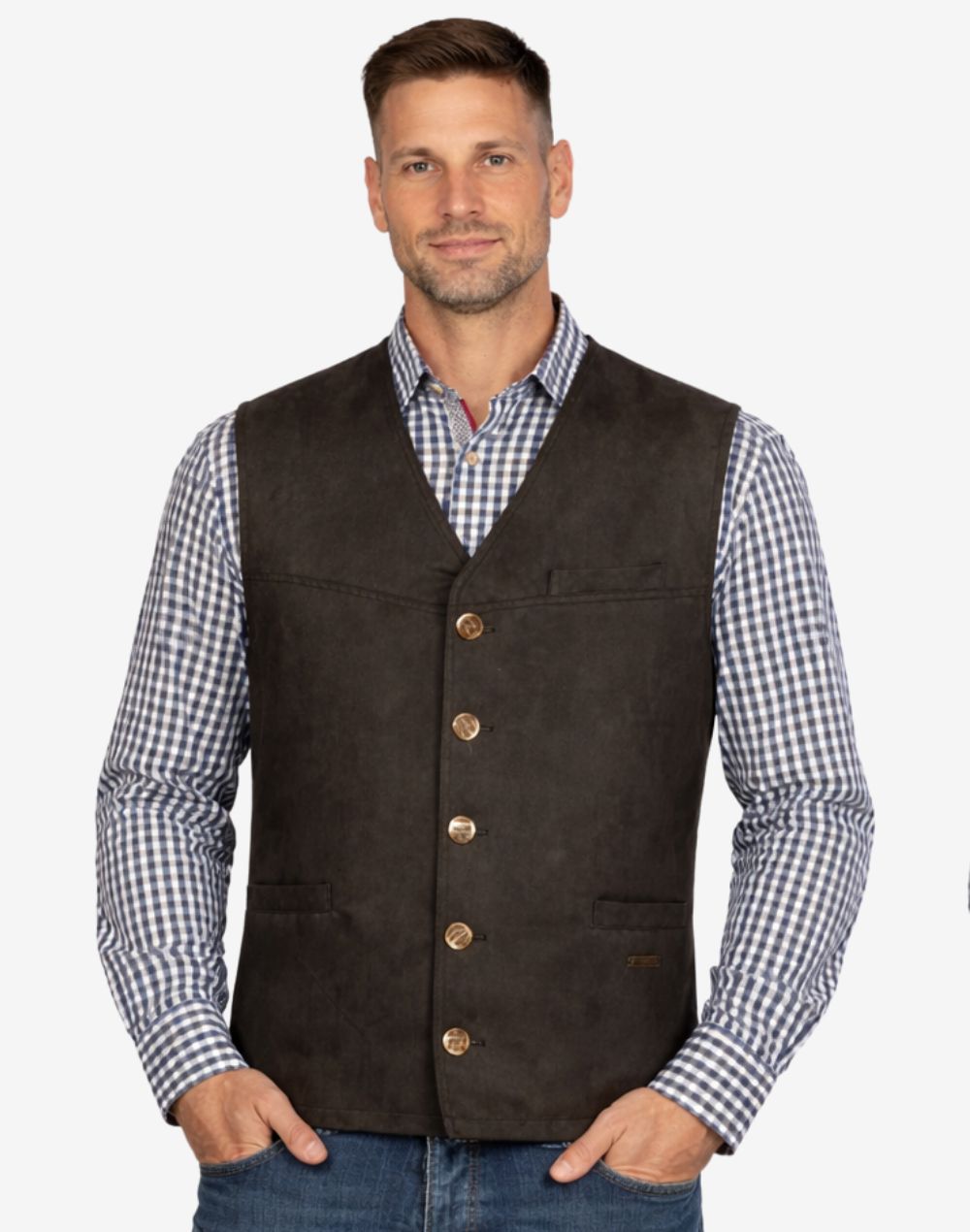 Model wearing mens rustic brown leather Trachten vest paired with checkered shirt and jeans, highlighting vintage finish, classic Bavarian style and versatile Oktoberfest outfit appeal.