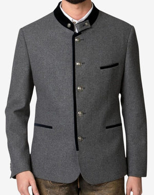 Angled view of model wearing rustic gray Trachten jacket with traditional stand collar and classic Oktoberfest styling.