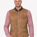 Model wearing tan suede Bavarian Trachten vest paired with checkered shirt and lederhosen for authentic alpine look.
