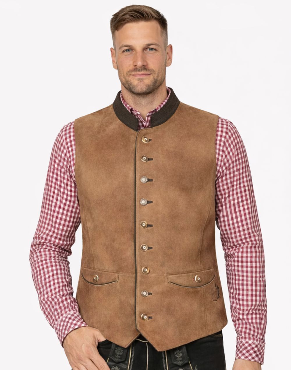 Model wearing tan suede Bavarian Trachten vest paired with checkered shirt and lederhosen for authentic alpine look.