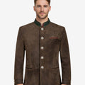 Front view of model wearing Mens Traditional Alpine Leather Jacket in vintage brown with green Bavarian collar and metal buttons