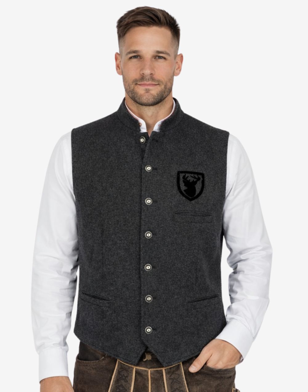Front view of model wearing Mens Traditional Alpine Vest in grey tweed with stag crest patch and metal buttons