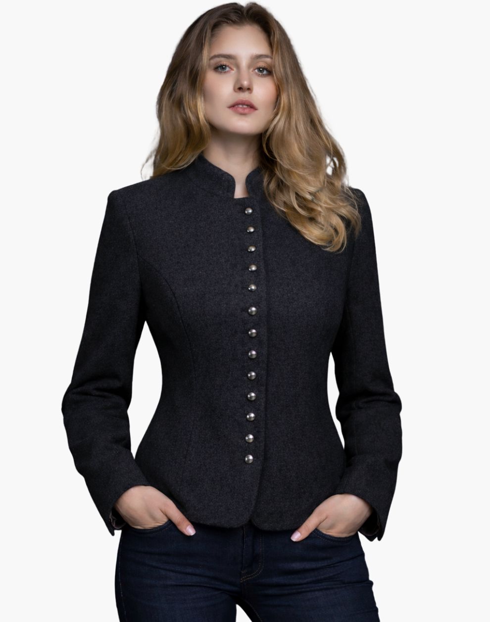 Woman wearing a charcoal grey Trachten-style jacket with decorative buttons, high collar, and a fitted tailored design, paired with dark jeans, against a white background.