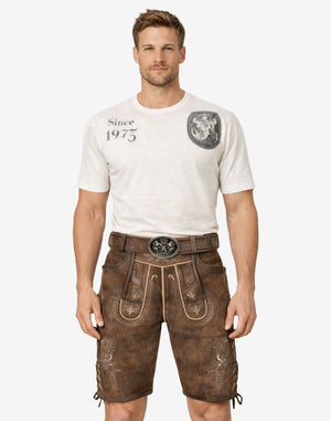 Front view of model wearing Munich Fest Men Lederhosen in brown leather with traditional Bavarian embroidery and belt buckle
