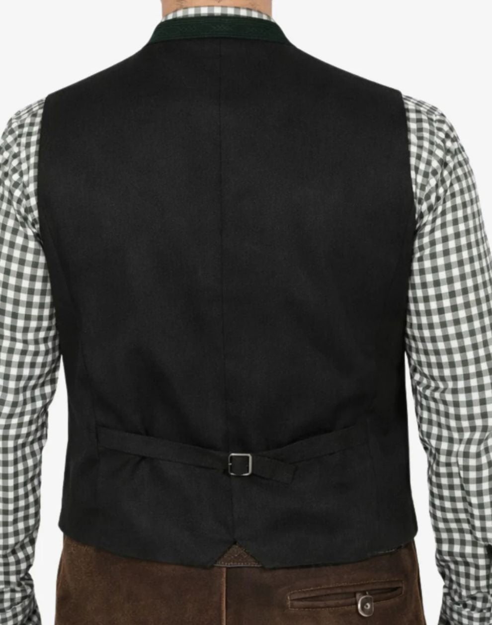 Black vest worn over a checkered shirt with brown pants on a plain background