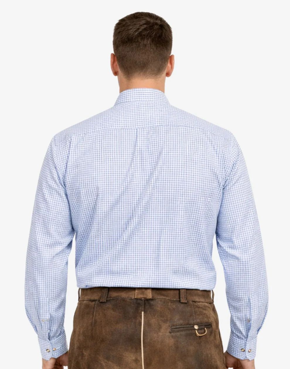 Man wearing a light blue checkered shirt and brown leather pants on a white background