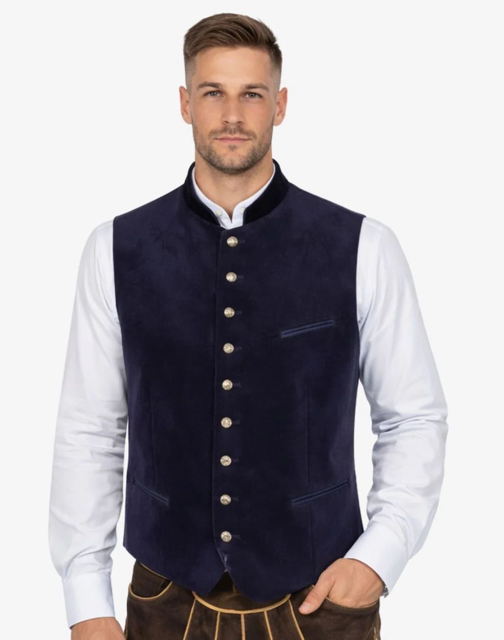 Man wearing a dark blue vest over a white shirt on a white background