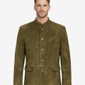 Model wearing olive suede leather men’s Bavarian jacket with traditional Trachten style, stand collar, button front, and classic Oktoberfest look.