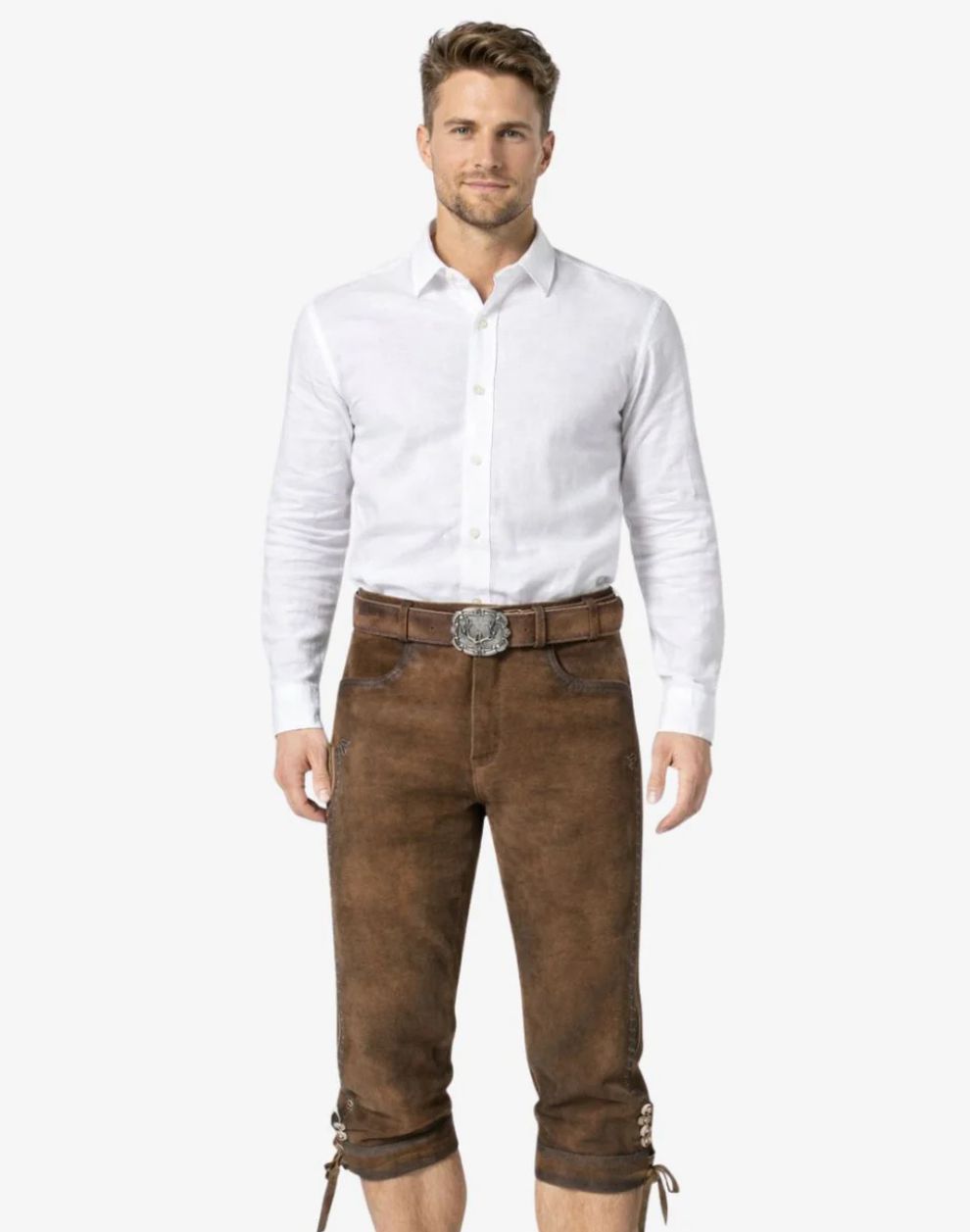 Man wearing a white shirt and brown leather pants on a white background