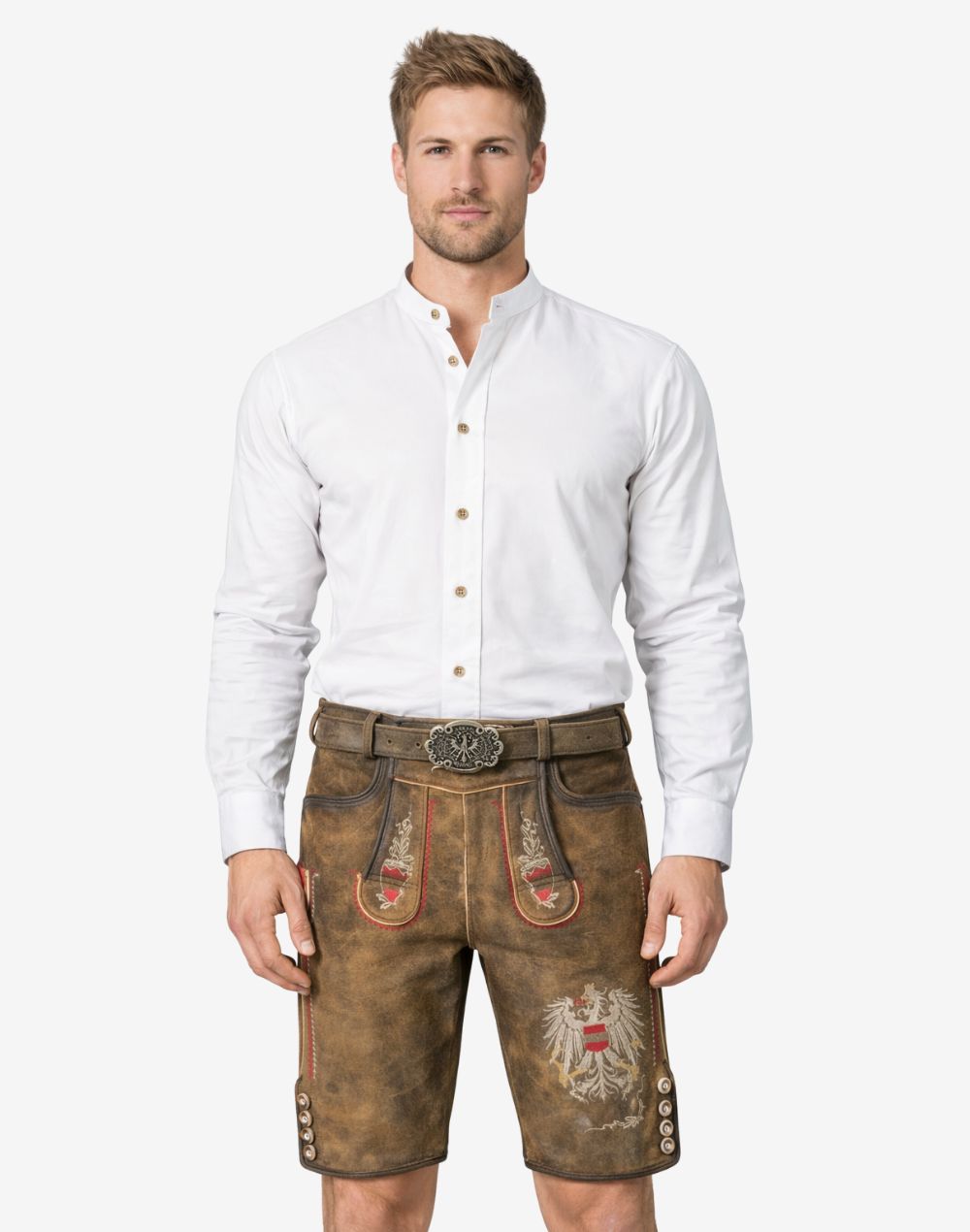 Model wearing premium Bavarian lederhosen for men in brown leather with traditional embroidery and belt buckle