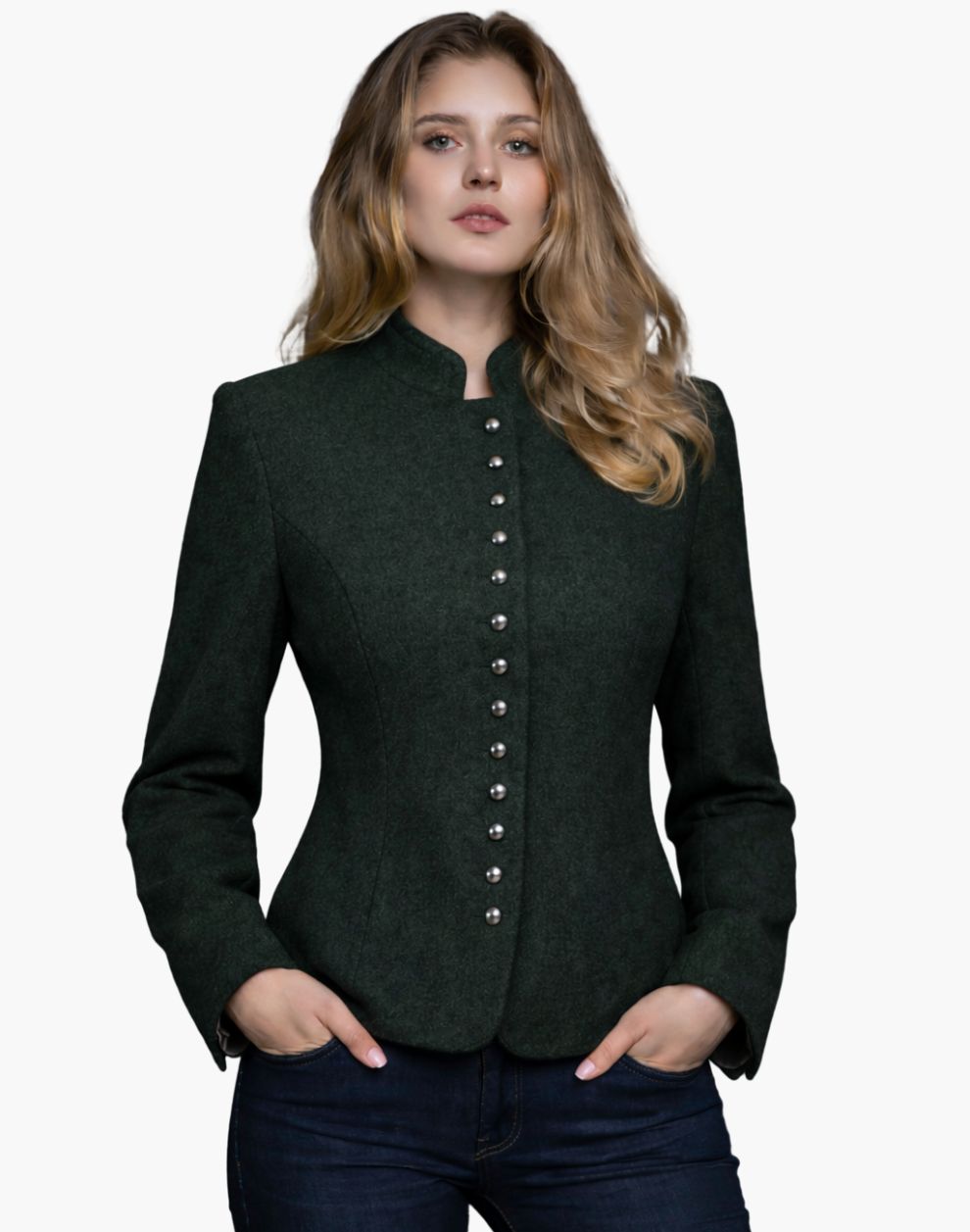 Woman wearing a dark green Trachten-style jacket with decorative buttons, high collar, and a fitted tailored design, paired with dark jeans, against a white background.