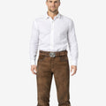 Front view of model wearing Premium Leather Bundhosen for Men in rustic brown with traditional Bavarian knee ties and Oktoberfest belt buckle