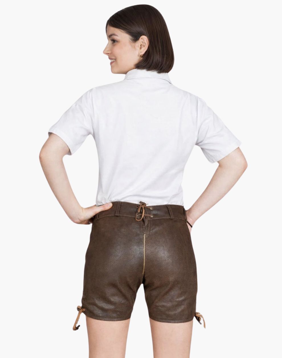 Person wearing a white shirt and brown leather shorts on a white background