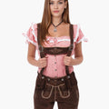 Woman wearing a traditional Bavarian outfit with a pink blouse and brown lederhosen on a white background