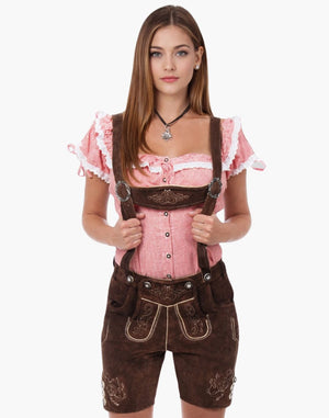 Woman wearing a traditional Bavarian outfit with a pink blouse and brown lederhosen on a white background