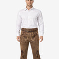Front view of model wearing premium Oktoberfest Bundhosen for men in brown leather with Bavarian embroidery and traditional knee tie details
