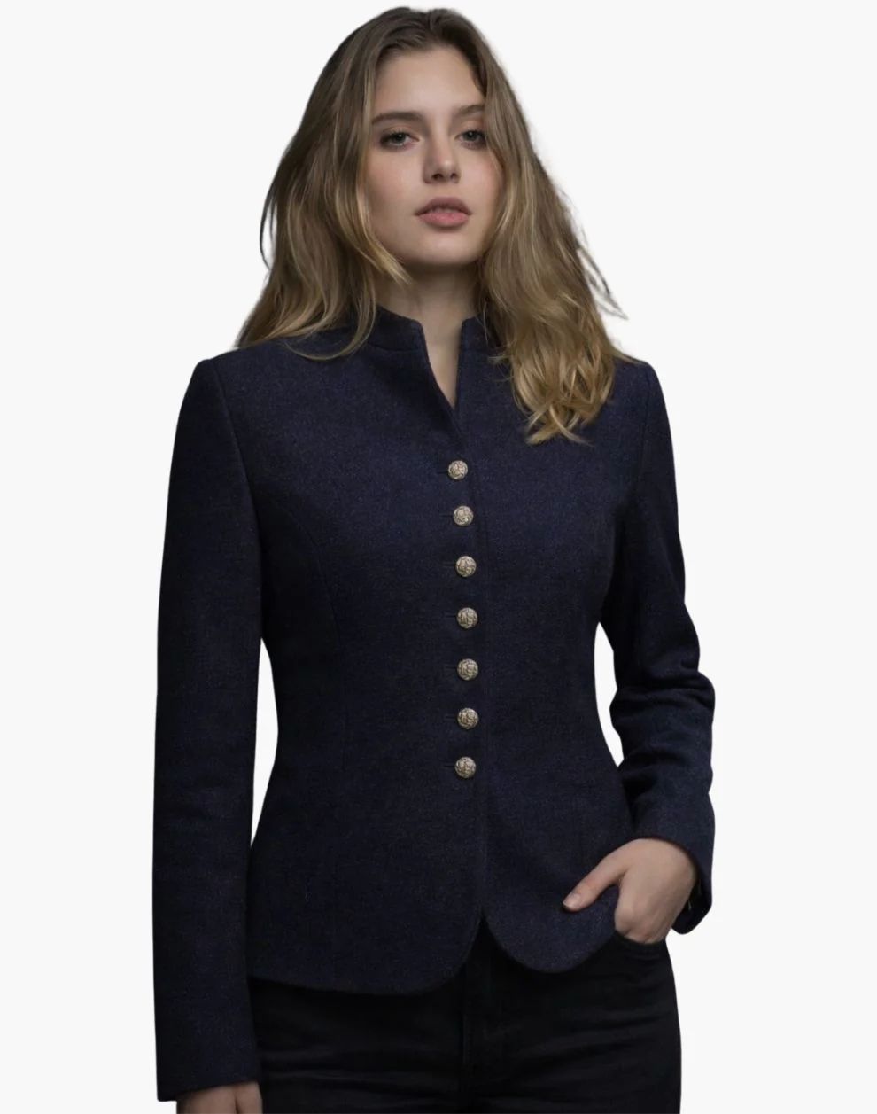 Woman wearing a navy blue blazer with gold buttons on a white background