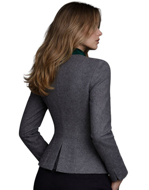 Woman wearing a gray blazer on a white background