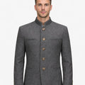 Front view of model wearing Premium Trachten Jacket for Men in grey with stand collar and wooden buttons