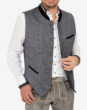 Model wearing premium Trachten vest featuring classic buttons, contrast trim pockets and authentic Oktoberfest inspired design