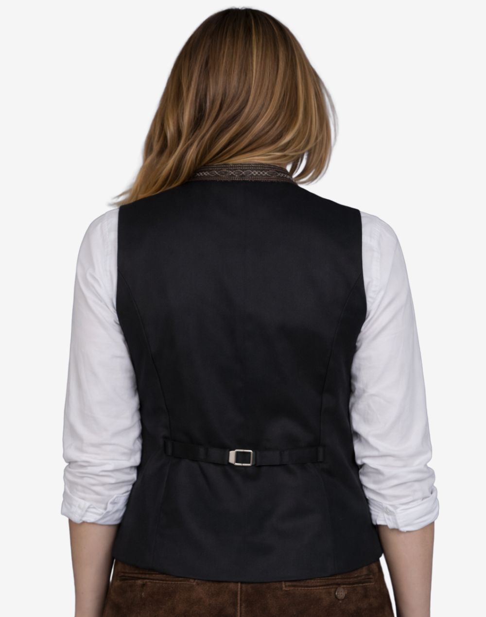 Person wearing a black vest over a white shirt on a white background
