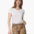 Woman wearing a white t-shirt and brown shorts with floral embroidery on a white background