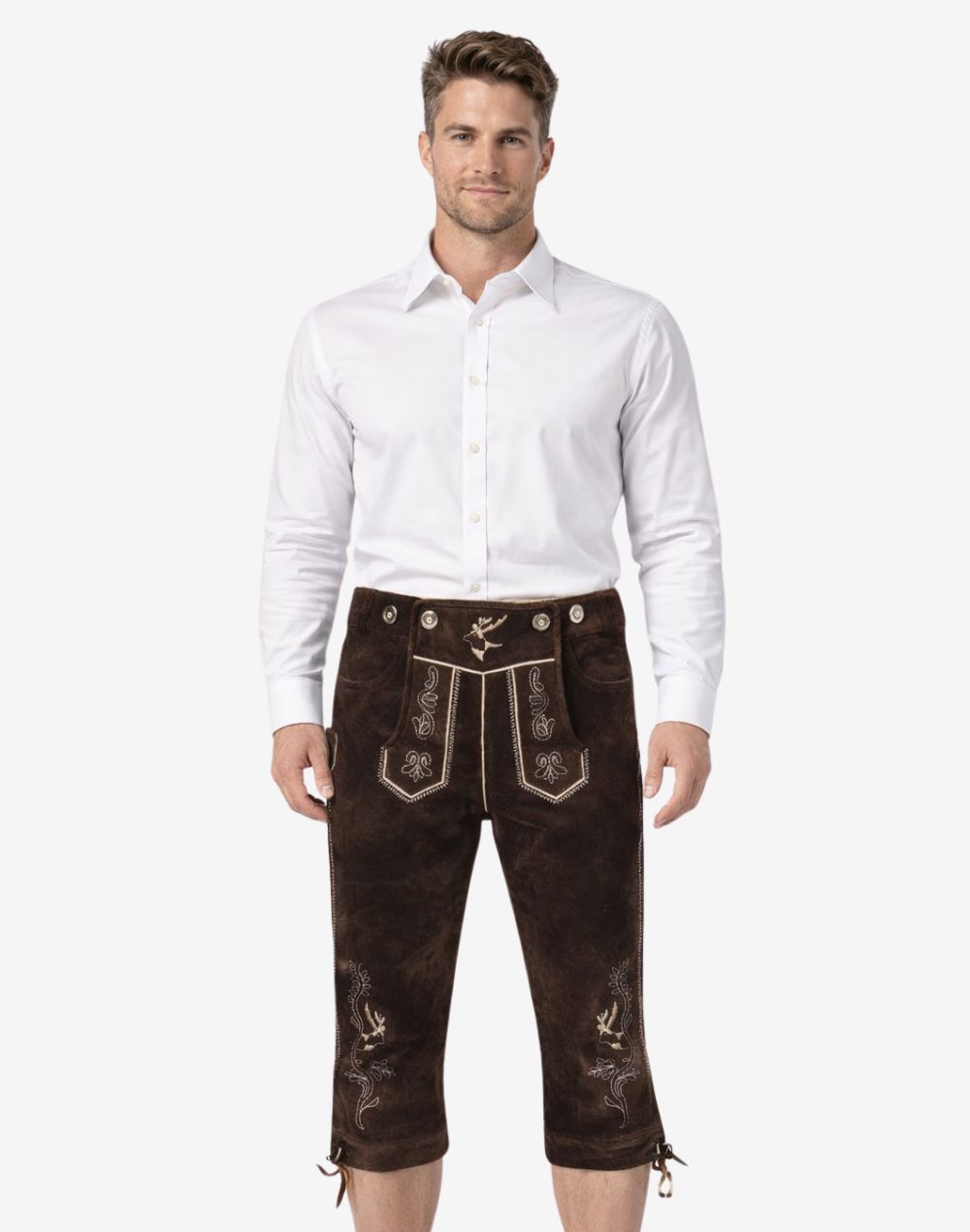 Front view of model wearing rustic leather Bundhosen for men in dark brown with Bavarian embroidery and traditional Oktoberfest knee tie details
