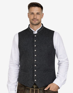 Male model wearing rustic wool Bavarian vest paired with traditional lederhosen, ideal for Oktoberfest and Alpine events.