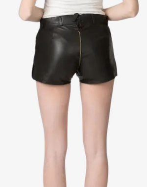 Black leather shorts worn by a person on a white background
