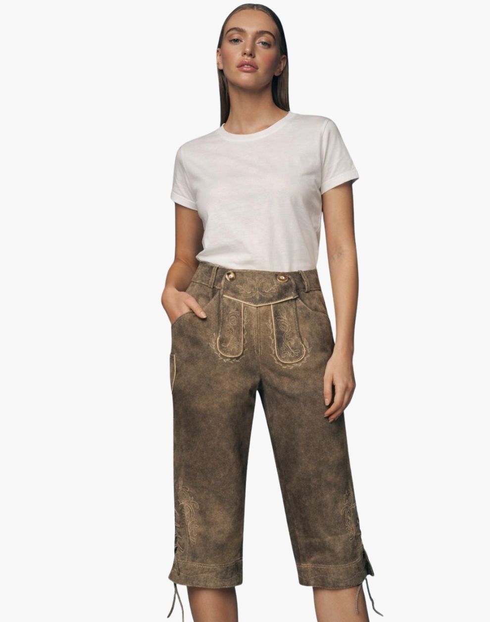 Woman wearing a white t-shirt and brown pants on a white background